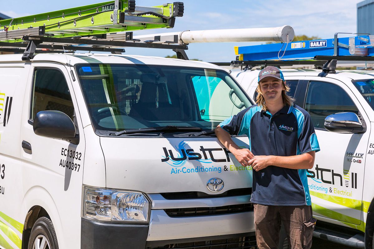 Colin from Just Chill standing with a service van, ready to assist.