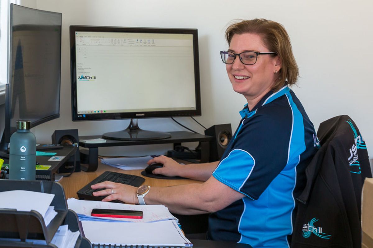 Sonia from Just Chill working at her desk, handling customer service.